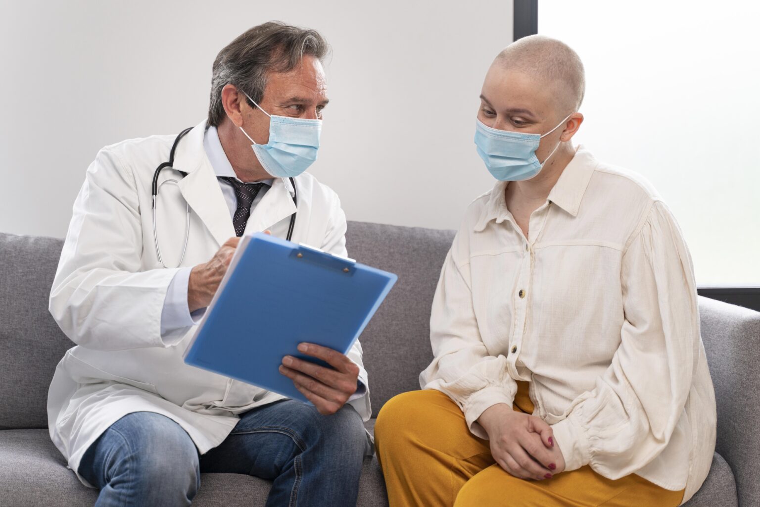 Young Woman Suffering Breast Cancer Talking With Her Doctor 1536x1024 